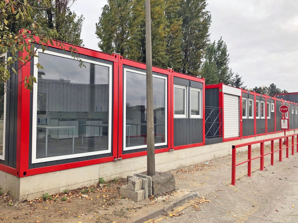 red and black steel portable retail cabins with large full pane windows